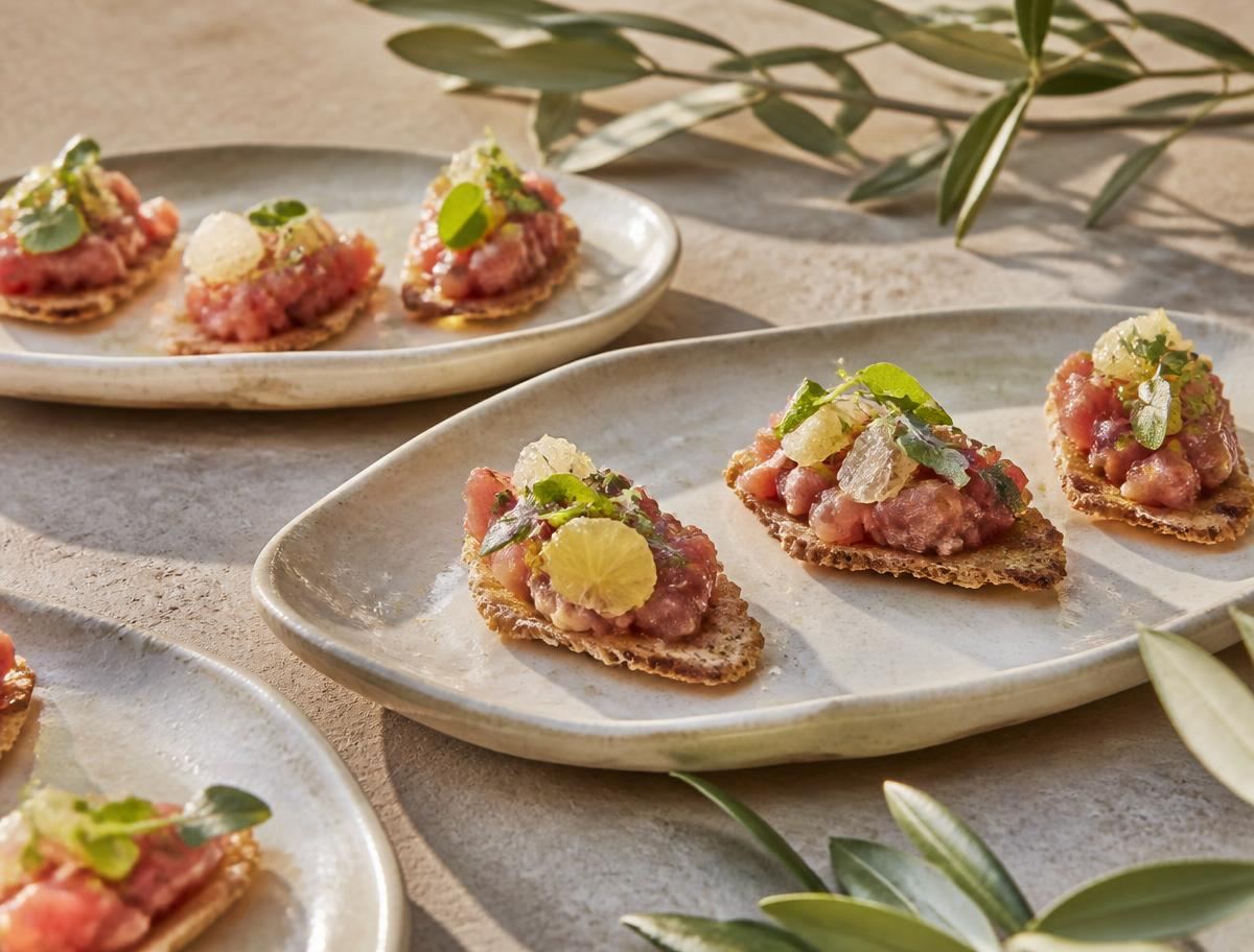 Mediterranean tuna tartare canapés on handmade ceramic plates
